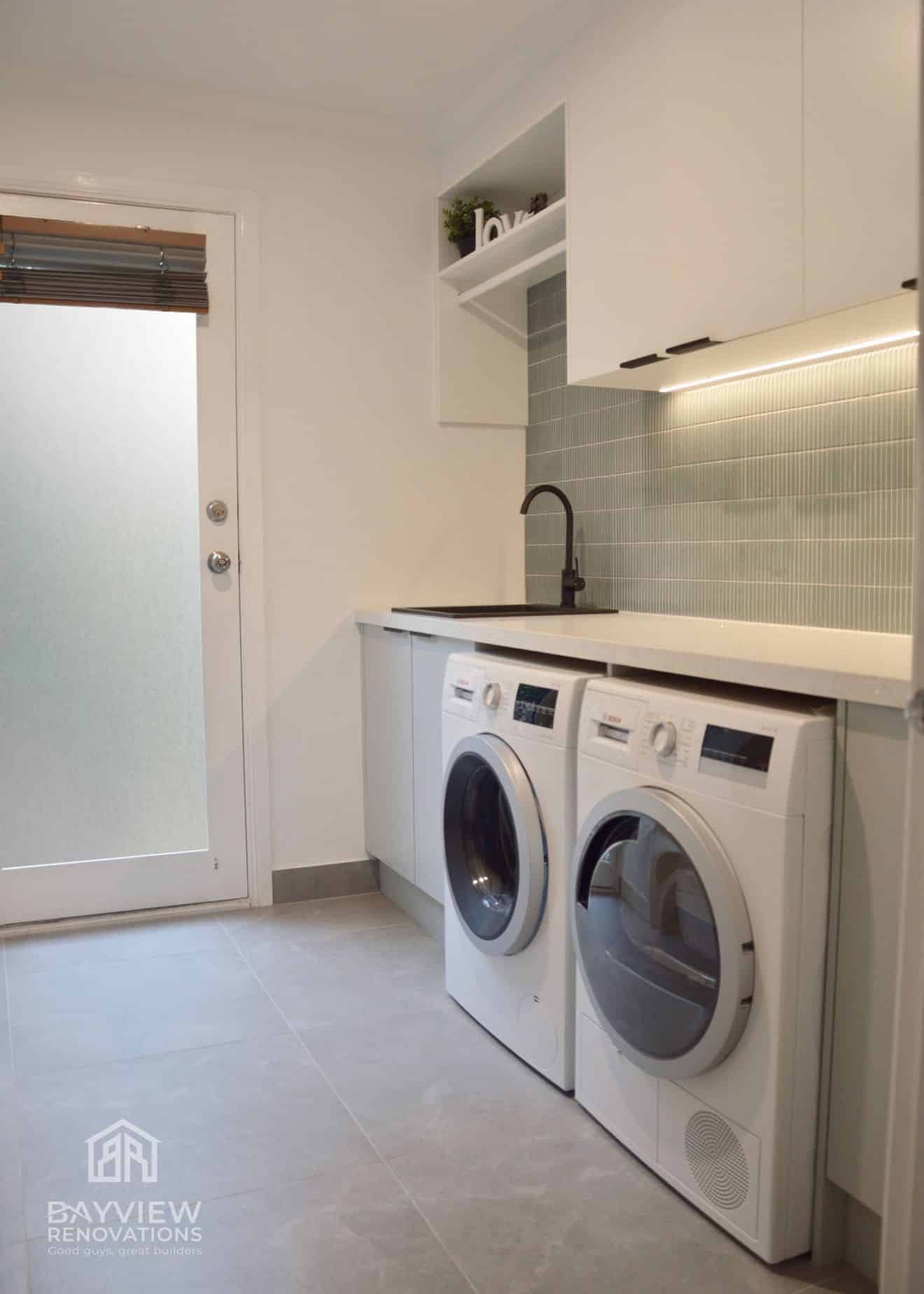 a laundry room with washer and dryer