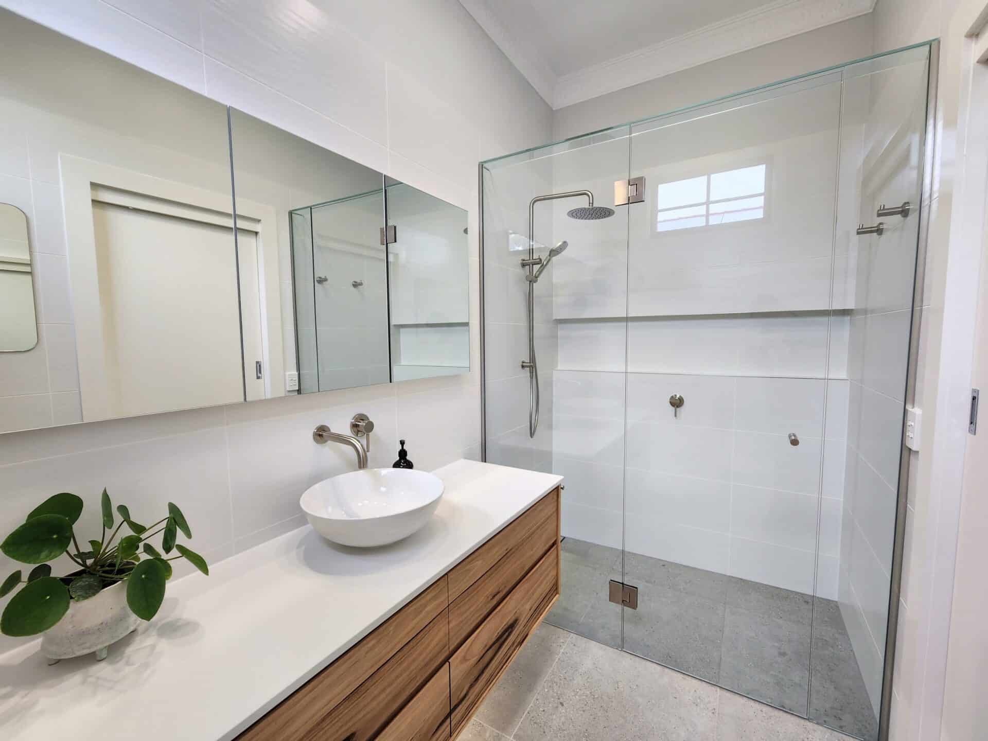 An ensuite renovation project in Hughes Street, Malvern East with a glass shower and sink.
