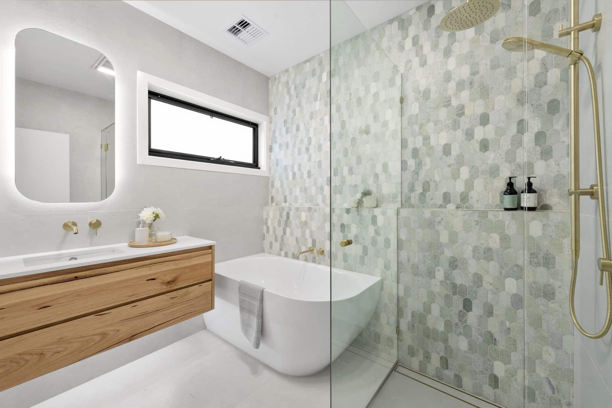 ensuite renovation with brass tapware and freestanding bath beaumaris